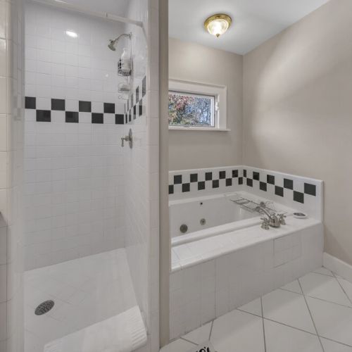 Bathroom 1 - Bath bathtub and a shower