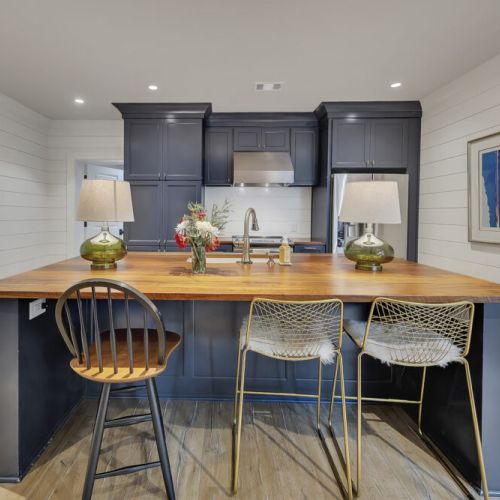 Basement Kitchen 2 -Gorgeous butcher-block island with seating for three.