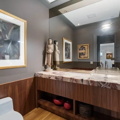 Elegant vanity space w/ detailed finishes & warm wood tones