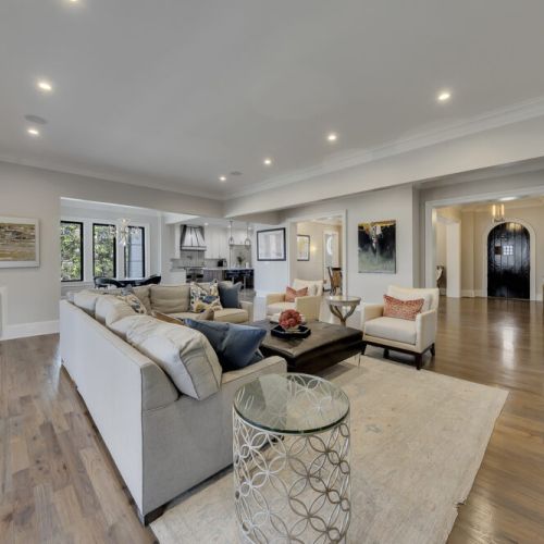 Bright primary living room w/ plush seating & open layout, perfect for gathering together