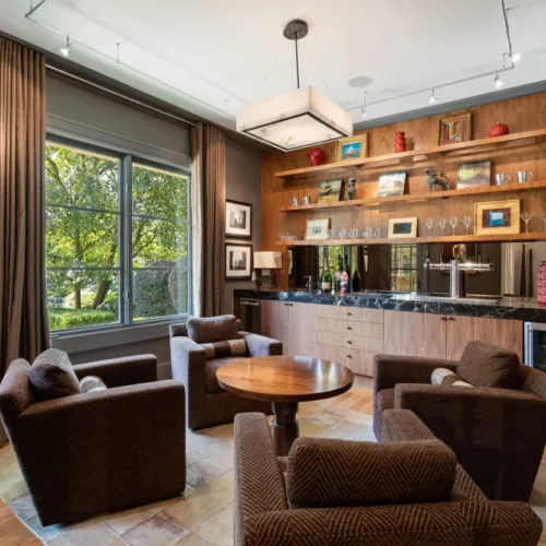 Cozy lounge nook w/ built-in shelving & warm natural light